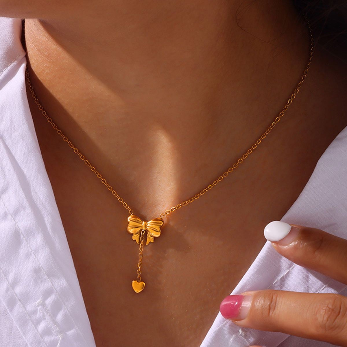 Bow heart drop necklace