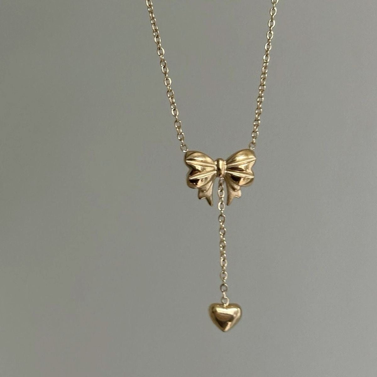 Bow heart drop necklace