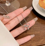 Minimal silver bow chain